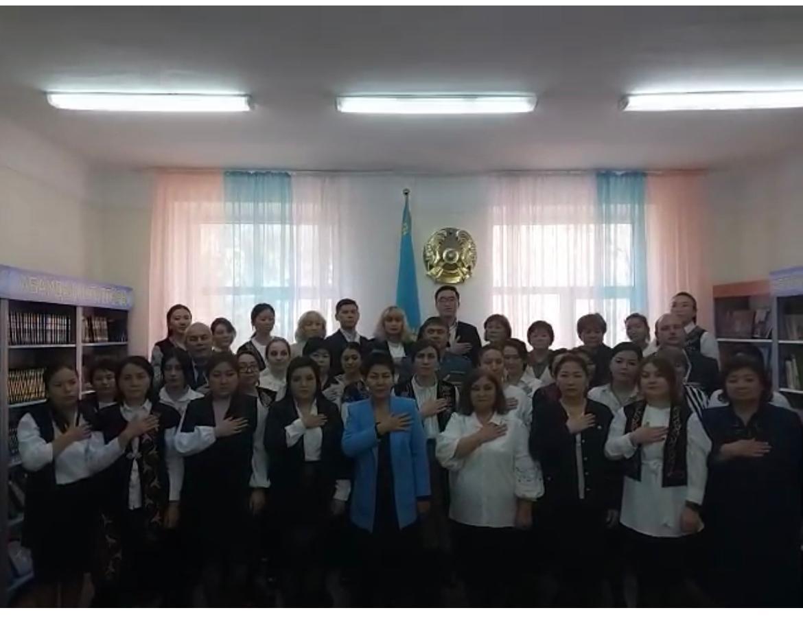Согласно плану школы в библиотеке школы прошел съемка исполнения государственного гимна Республики Казахстан педагогическим коллективом школе